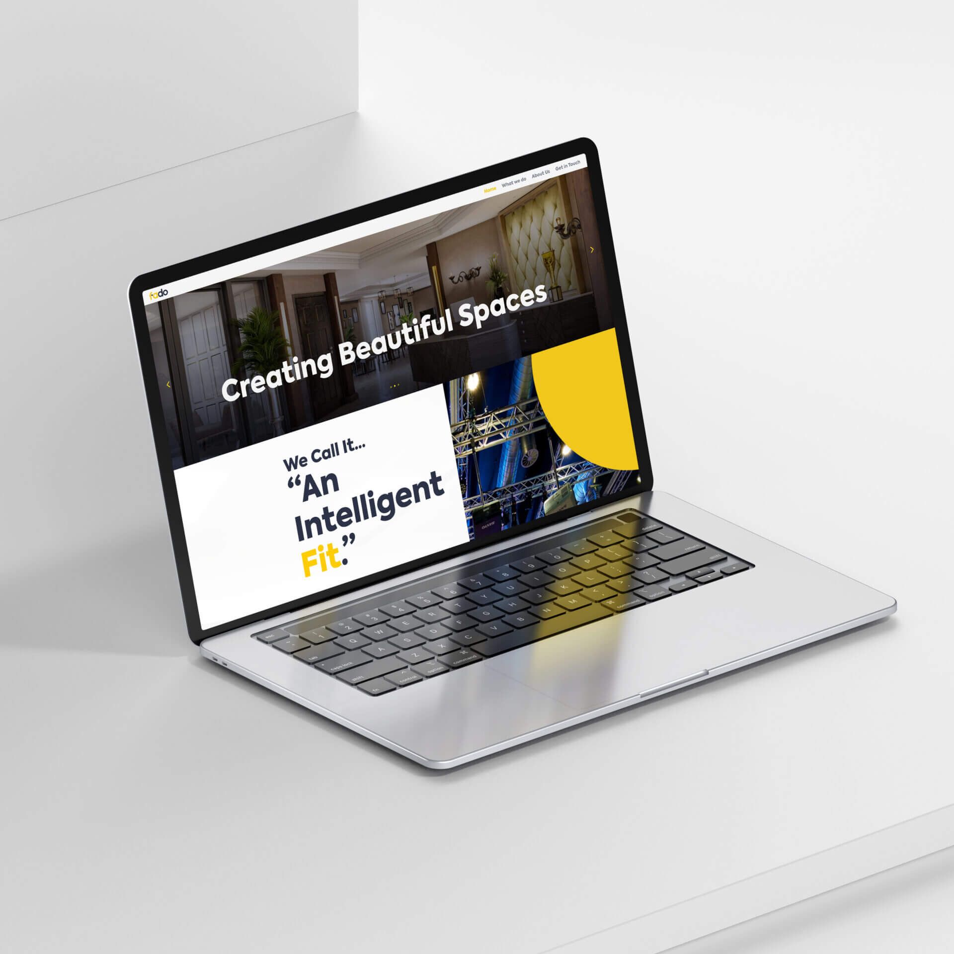 The Fado website on a laptop, with the headline Creating Beautiful Spaces